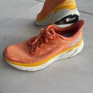 Hoka 9.5 US women’s running shoes in coral